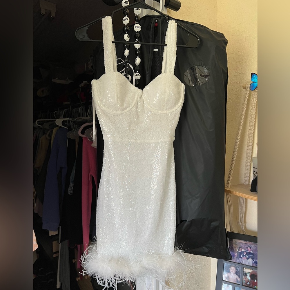 Sequin white dress with boa trim around the bottom